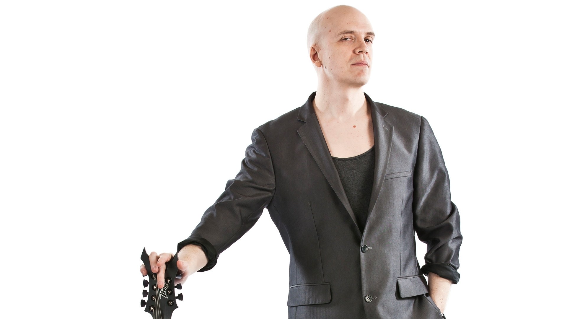 man holding guitar headstock
