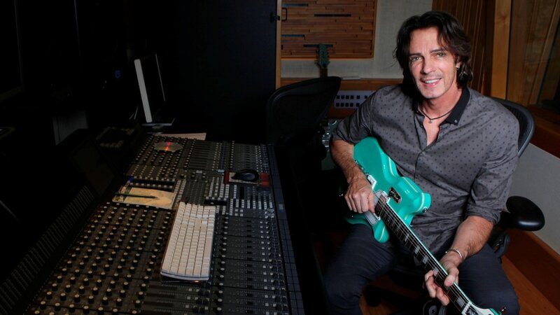 Man Holding Guitar — Teal