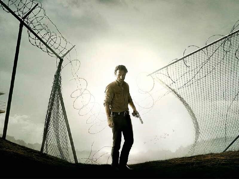 Man Holding Gun — Gray, Dramatic, Photograph, Barbed Wire