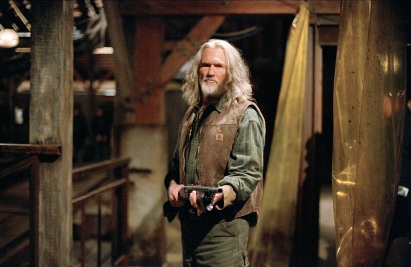 Man holding gun in barn
