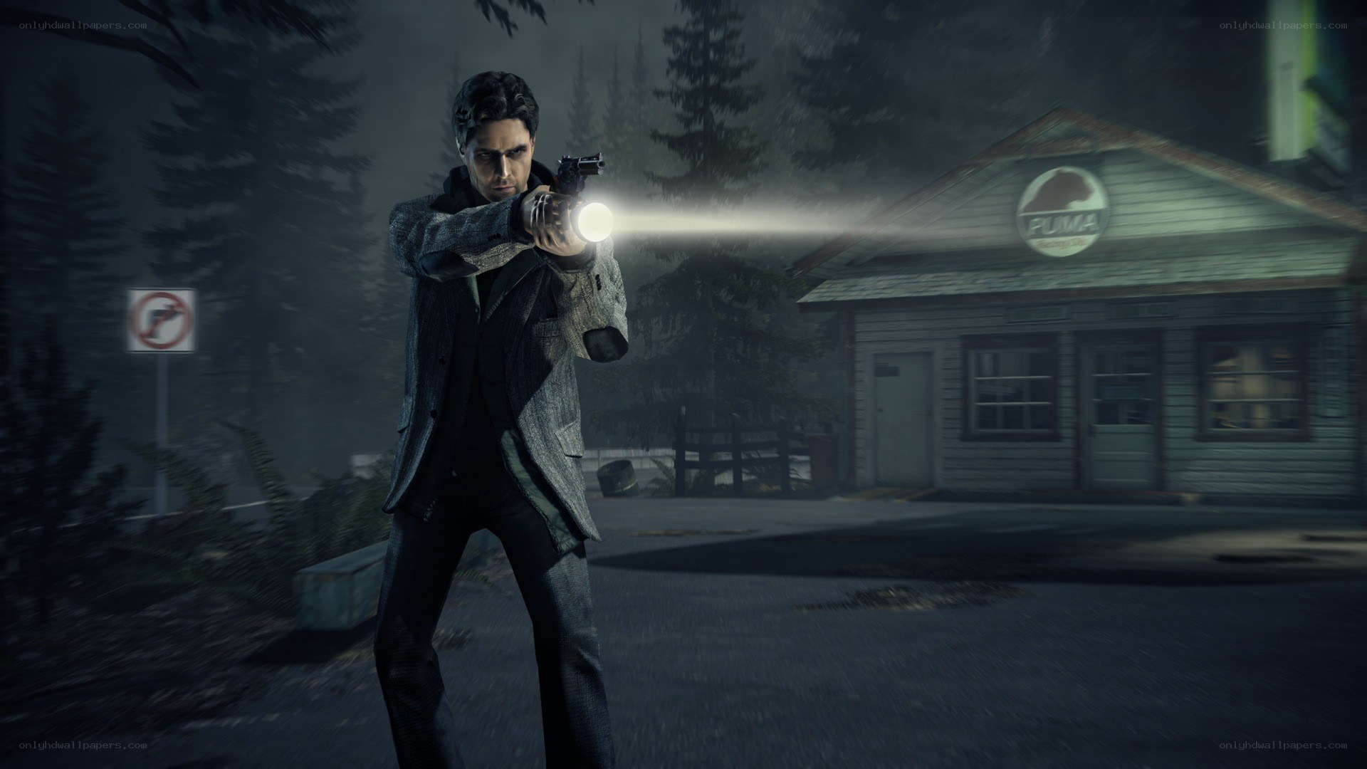 man holding gun in dark forest