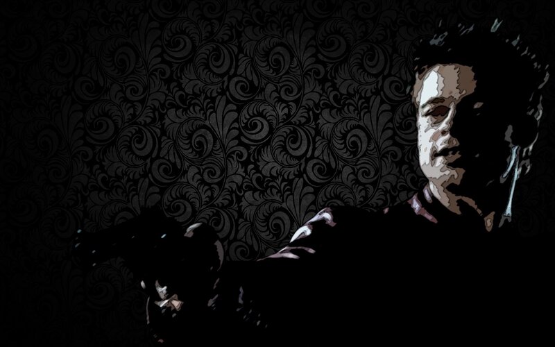 man holding gun in dark room