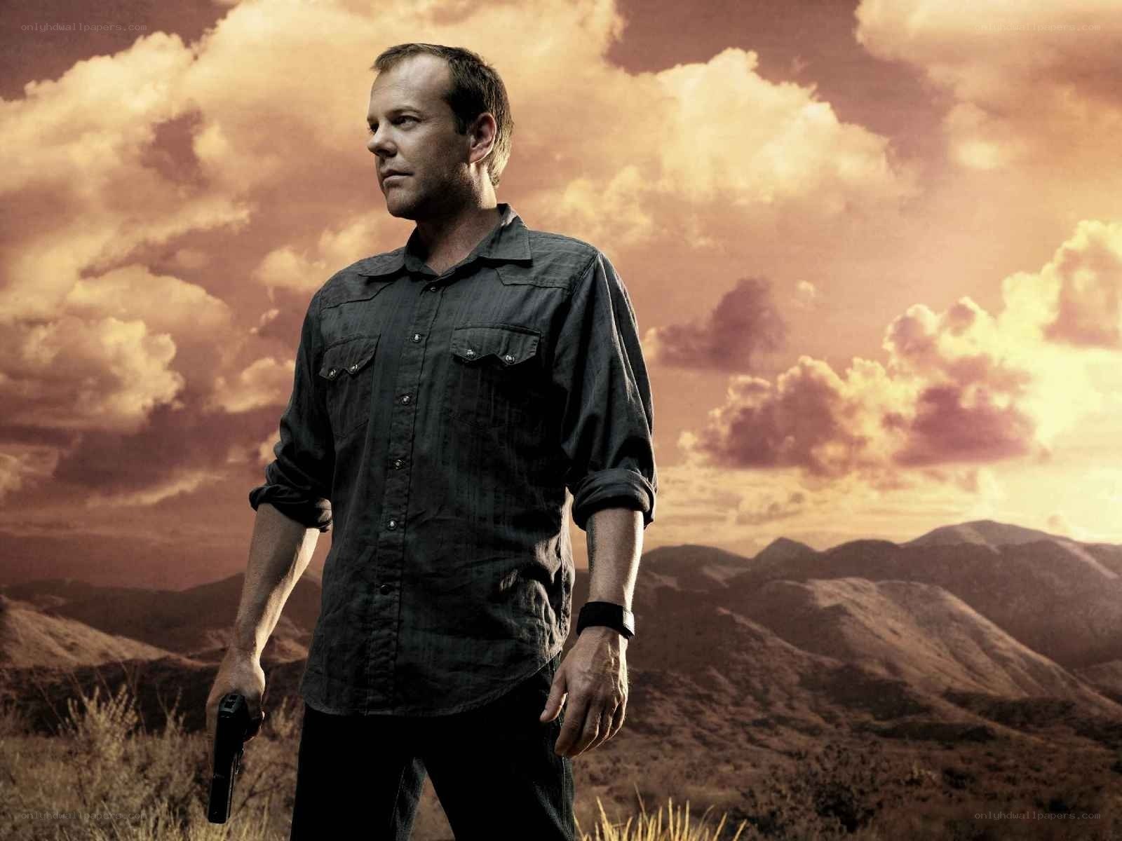 man holding gun in desert