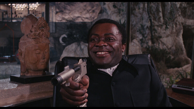 man holding gun in office