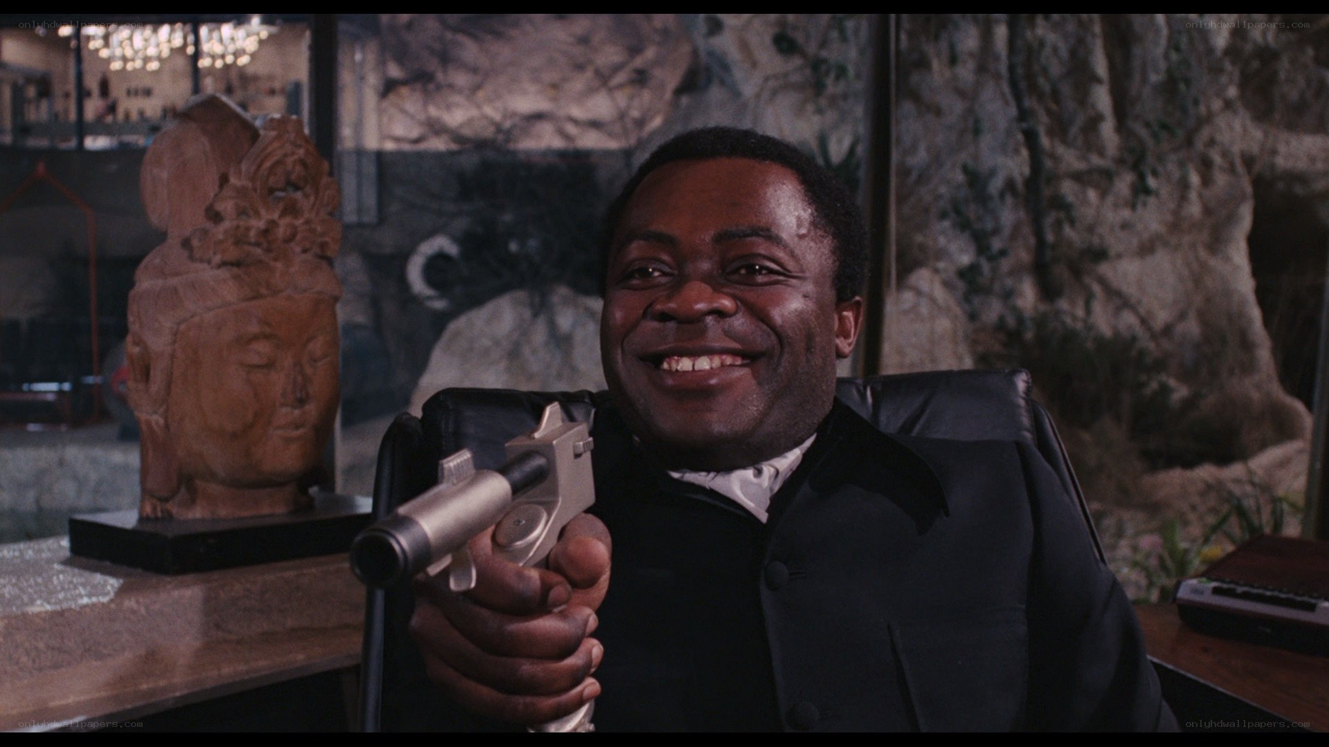 man holding gun in office