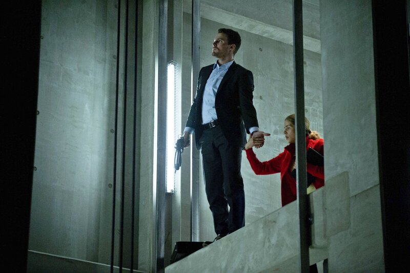 Man holding gun in stairwell