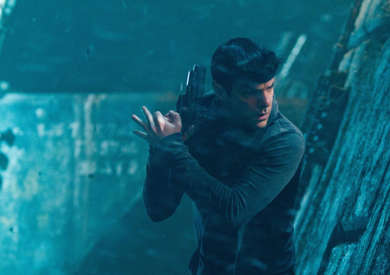 man holding gun underwater