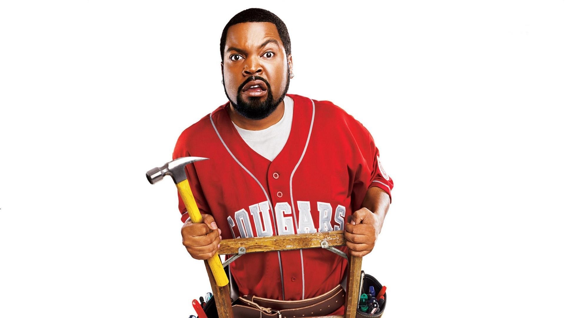 man holding hammer and tools