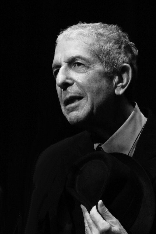 Man holding hat in black and white