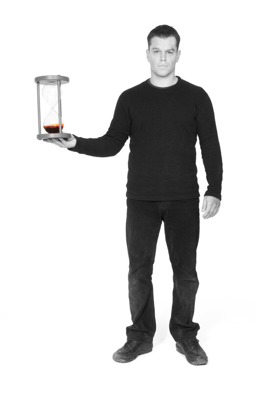 man holding hourglass