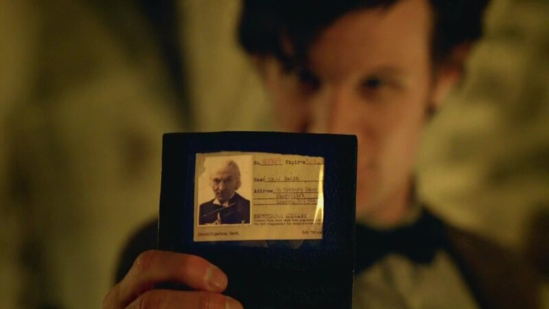 man holding identification card