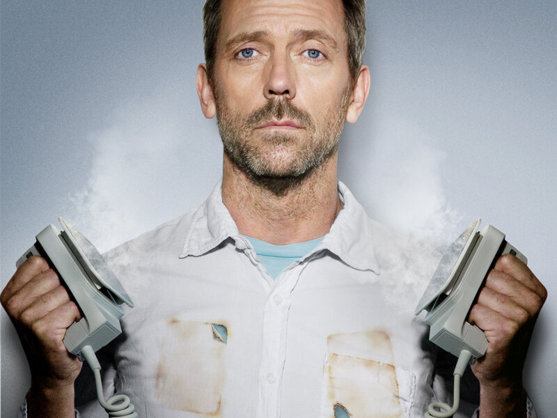 man holding irons with steam