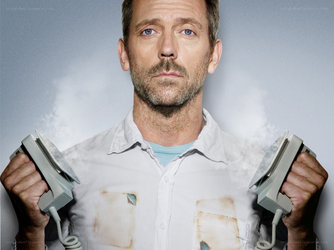 man holding irons with steam