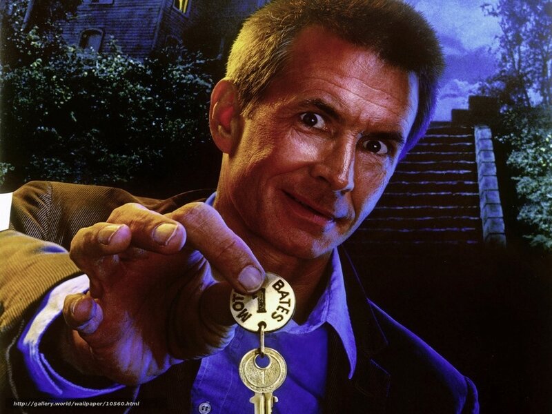 Man holding key with Bates Motel tag