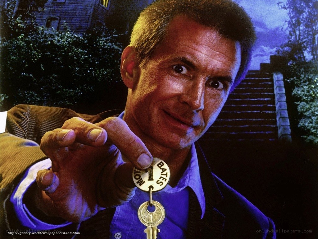 Man holding key with Bates Motel tag