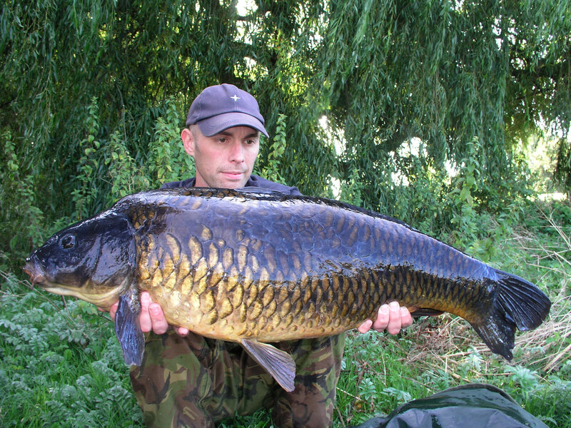 Man Holding Large Carp