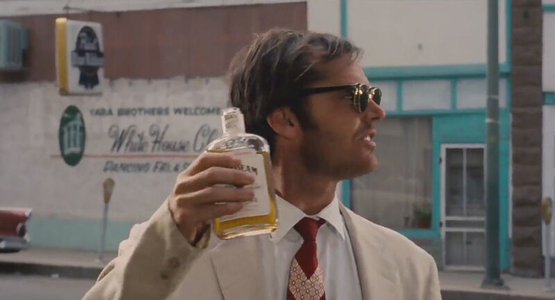 Man Holding Liquor Bottle