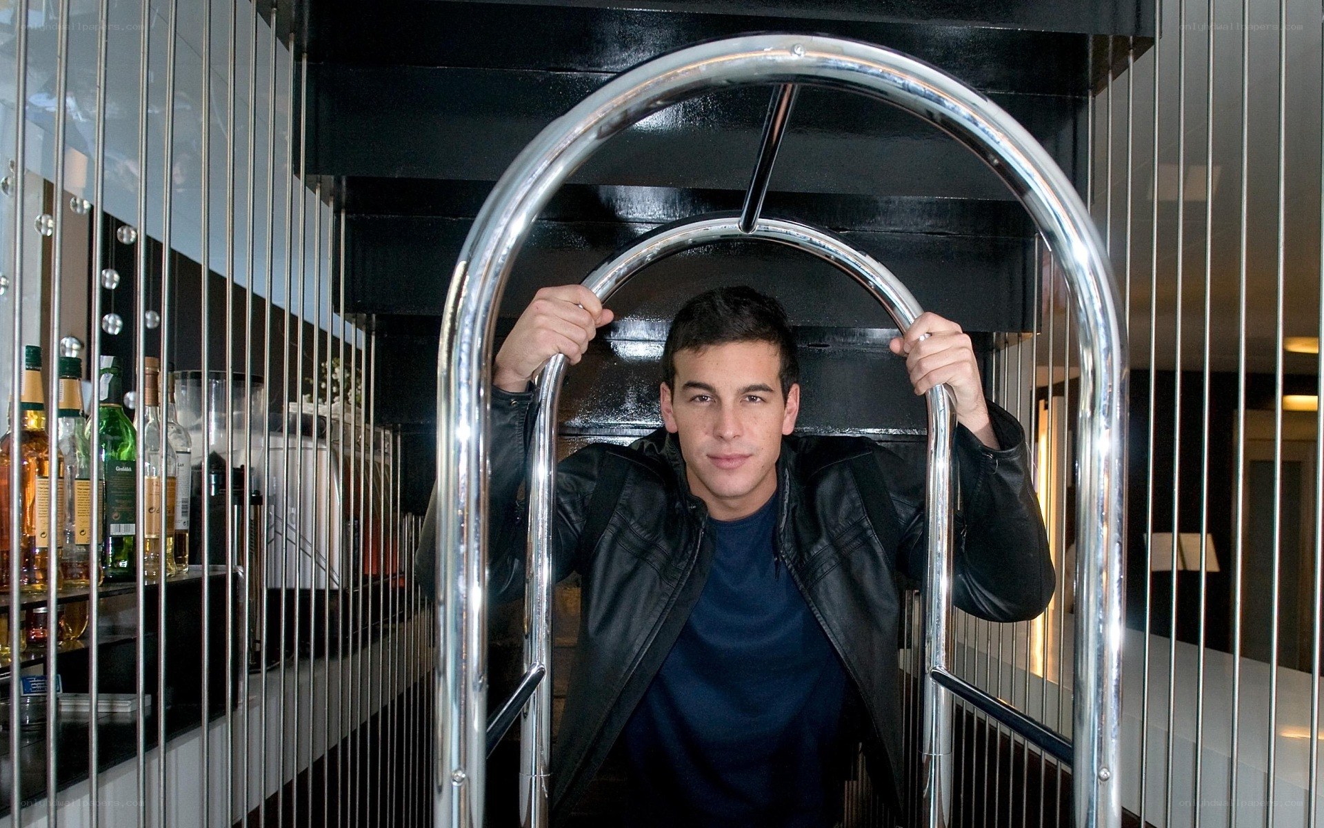 man holding luggage cart