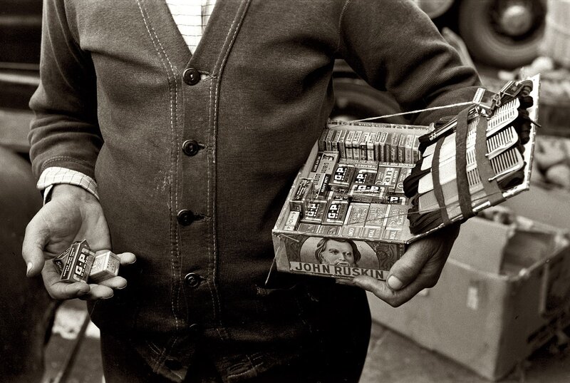 man holding matchboxes