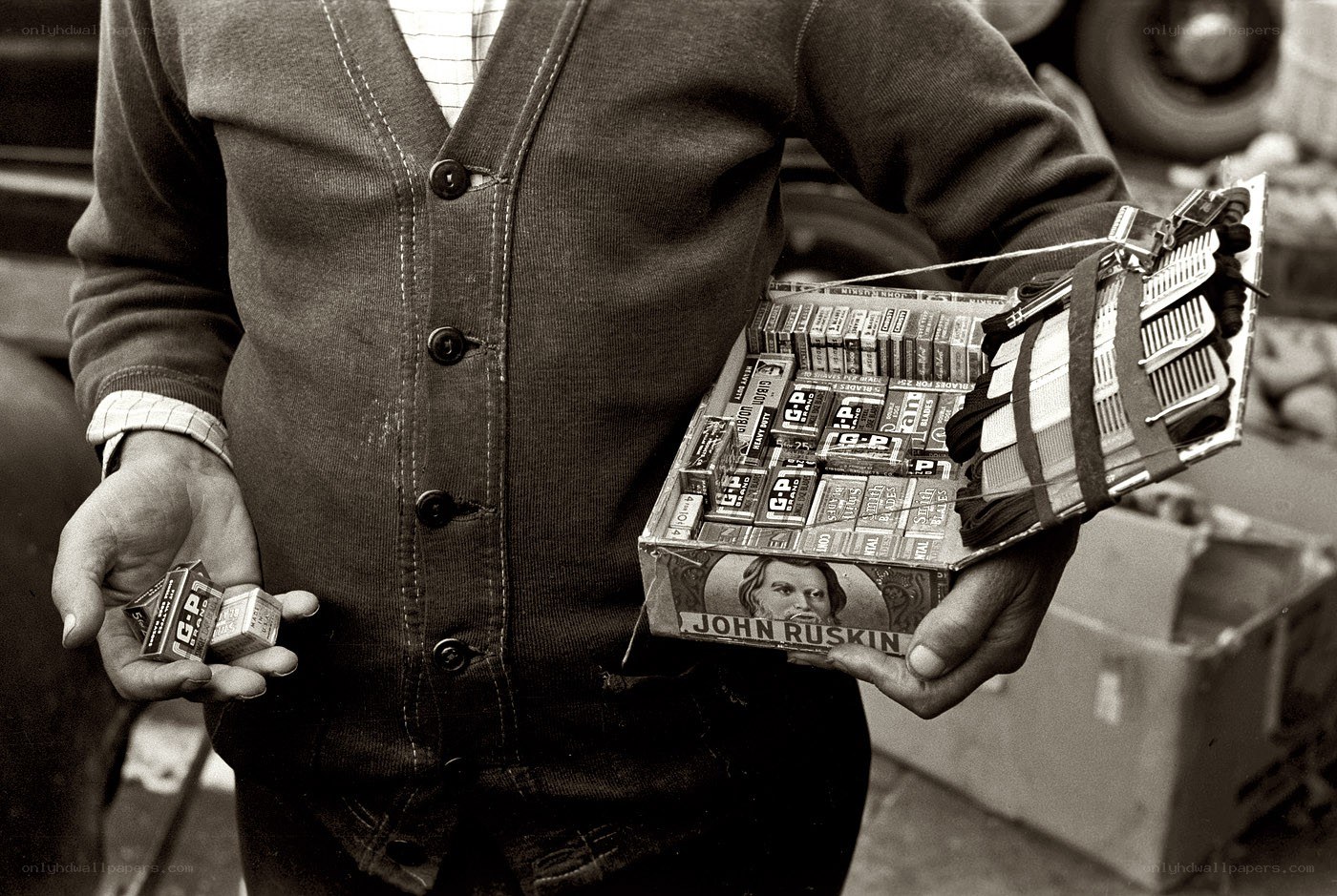 man holding matchboxes
