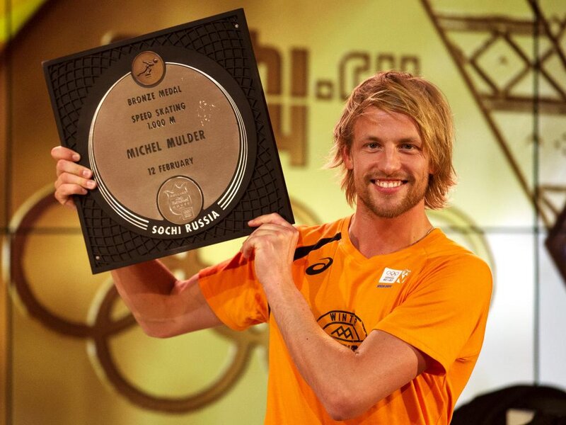Man Holding Medal — Orange