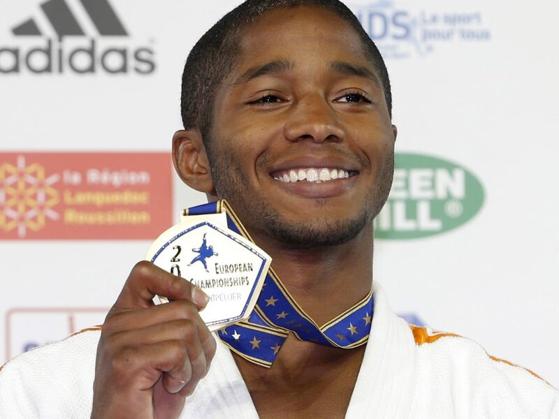 Man Holding Medal — White