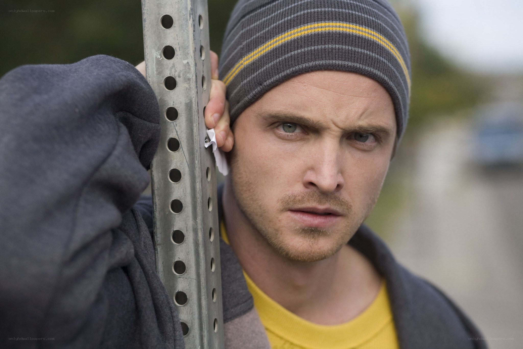 man holding metal pole