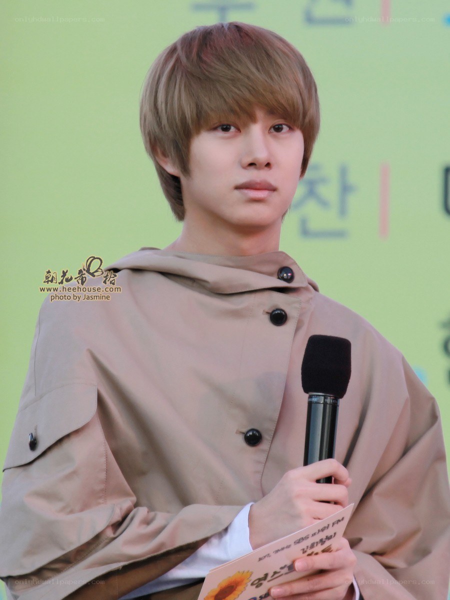 man holding microphone at event