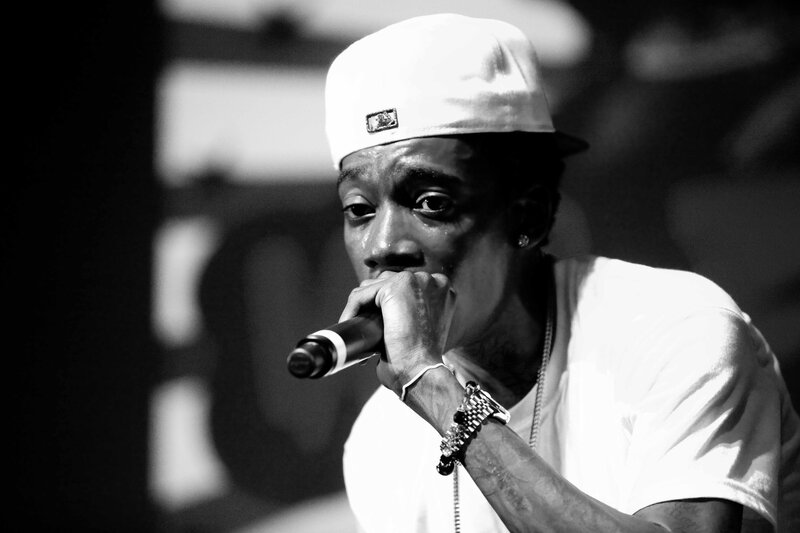Man Holding Microphone — Black, Intense