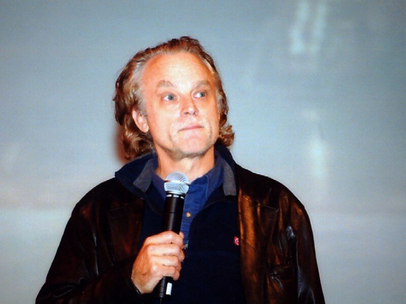 Man Holding Microphone — Brown