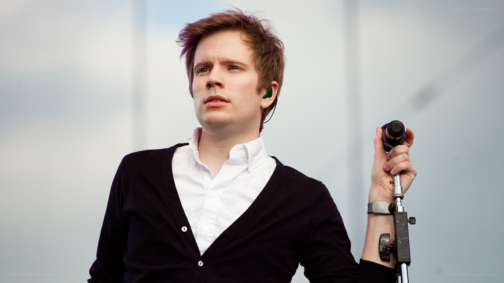 man holding microphone on stage