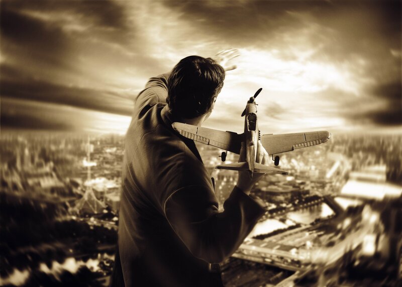 Man holding model airplane