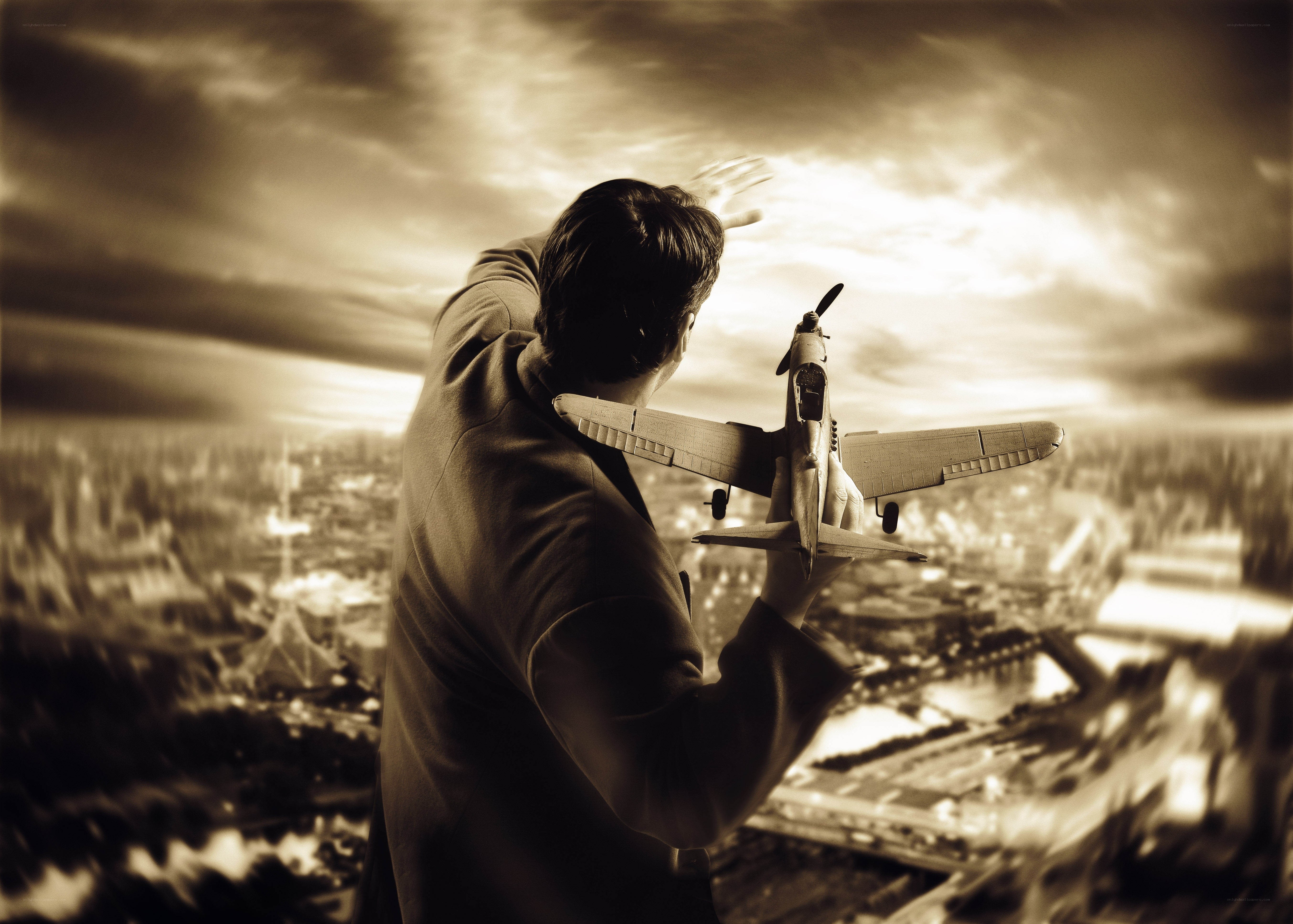 Man holding model airplane