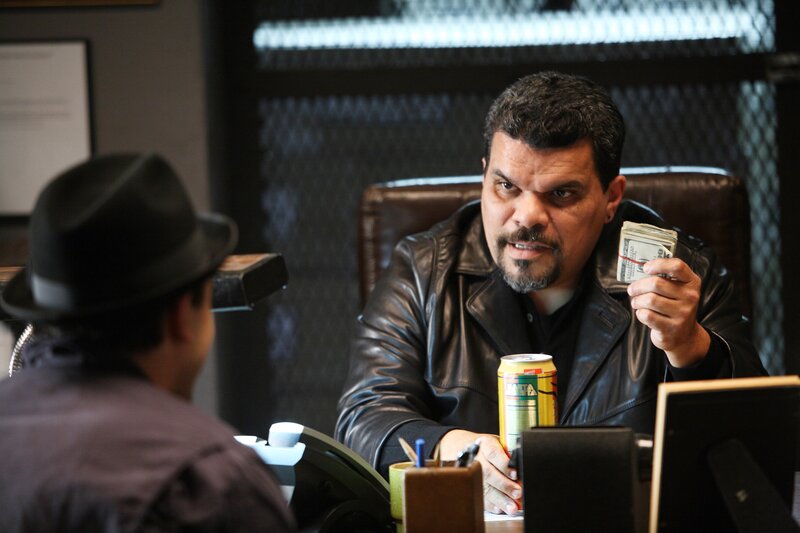 Man holding money in office