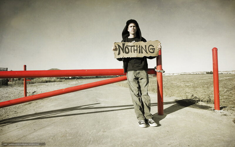Man holding 'NOTHING' sign