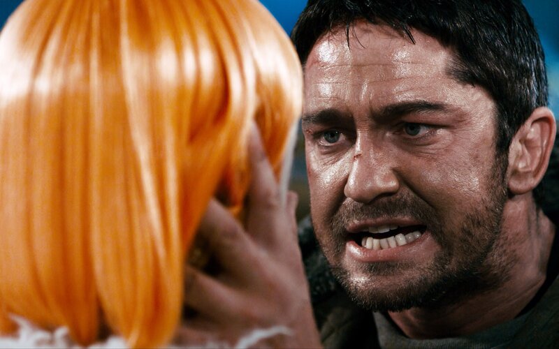 Man Holding Orange Wig