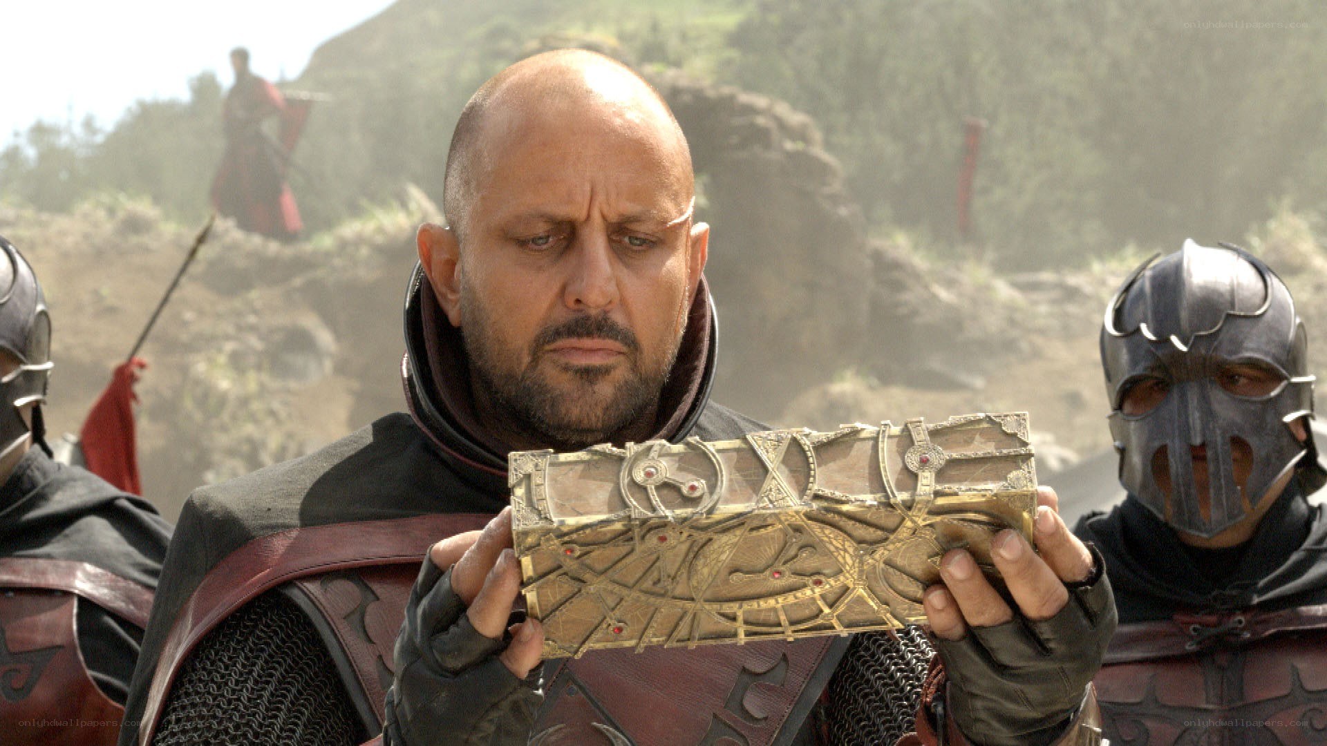 Man holding ornate artifact