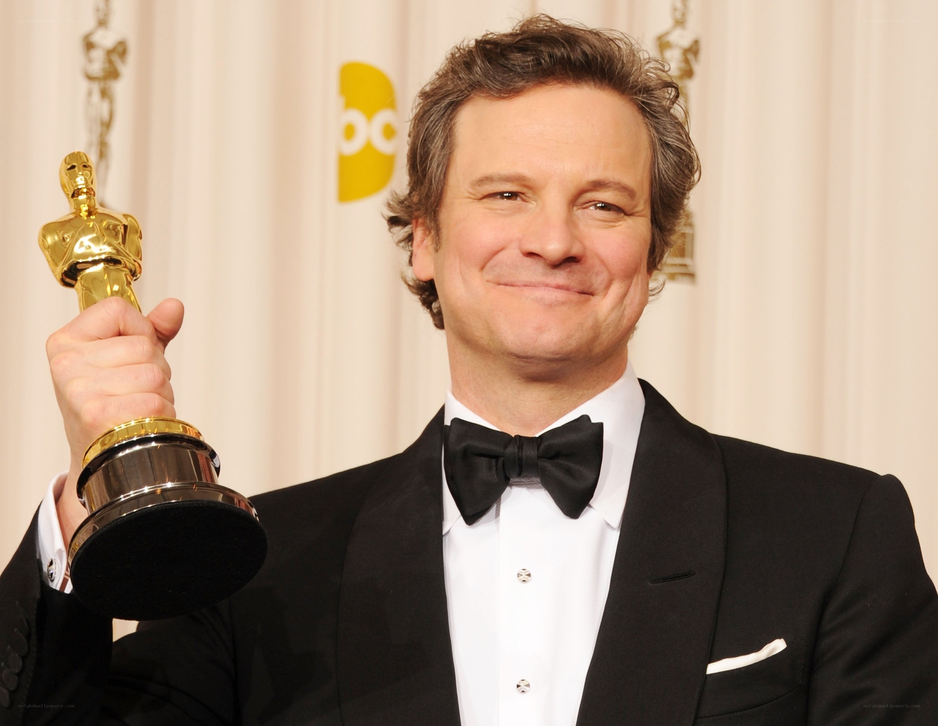 man holding oscar award