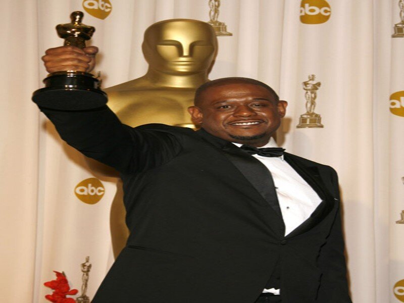 Man Holding Oscar Statue