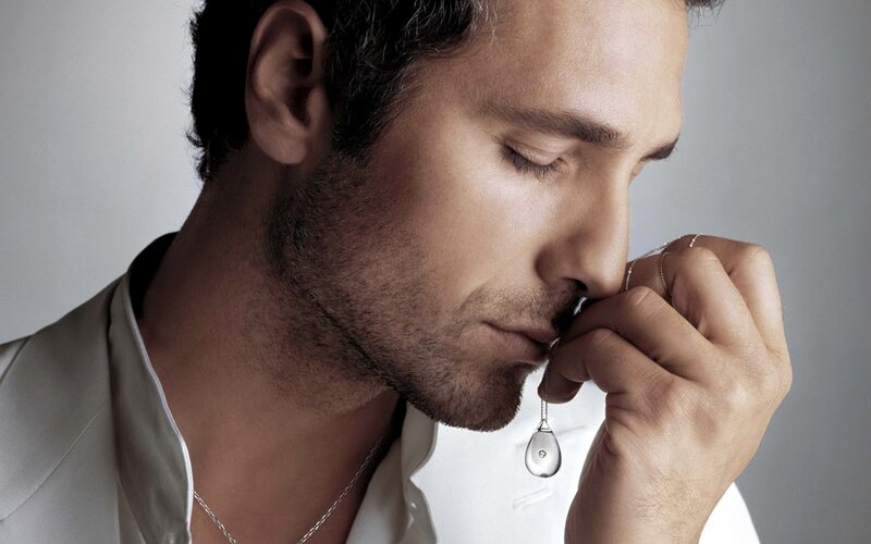 Man Holding Pendant