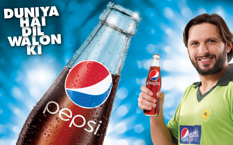 Man Holding Pepsi Bottle