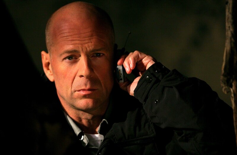 Man Holding Phone — Black, Serious