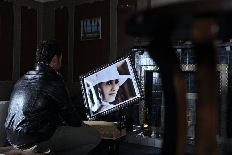 Man Holding Photo