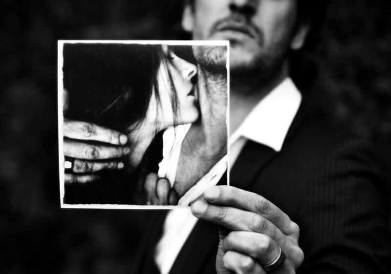 Man Holding Photograph