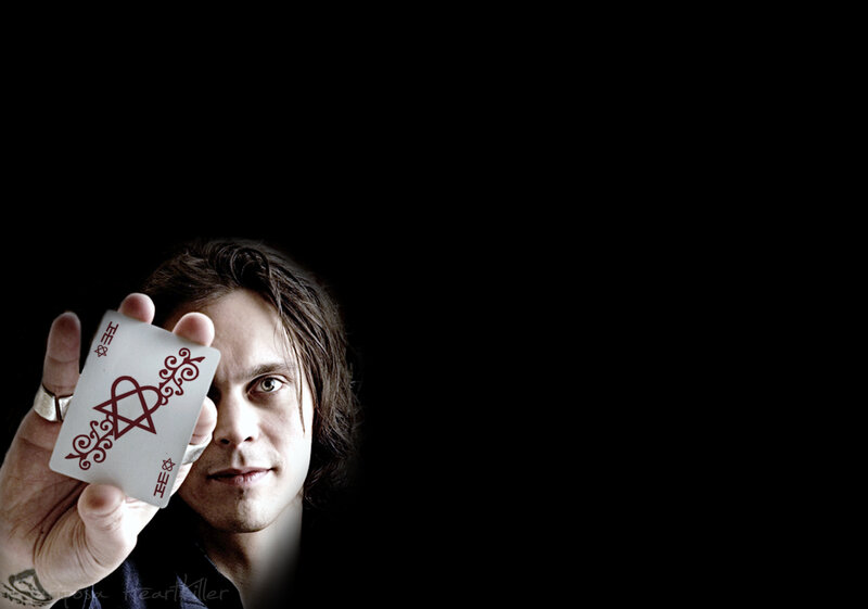 Man Holding Playing Card — Black