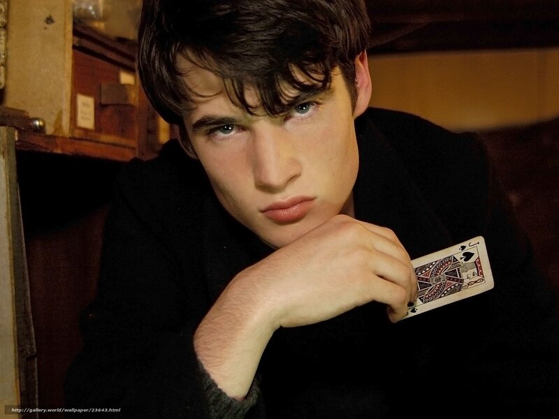 man holding playing card