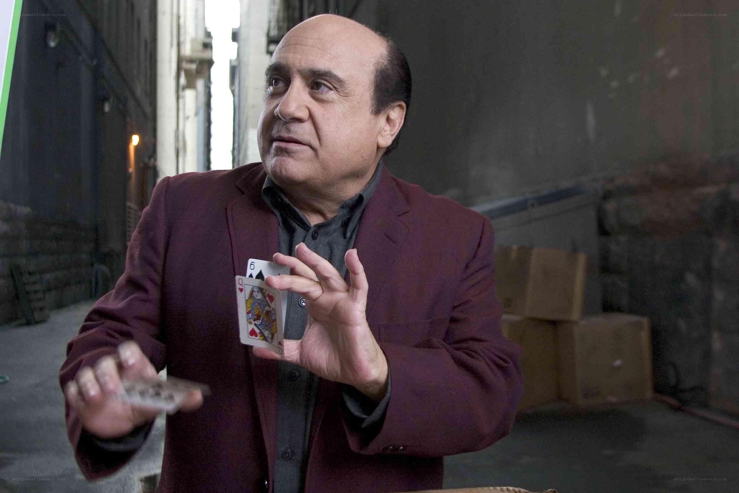 man holding playing cards
