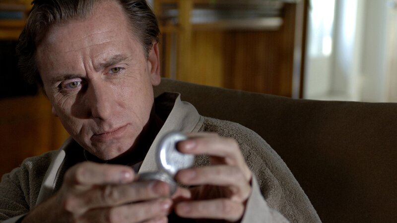 man holding pocket watch