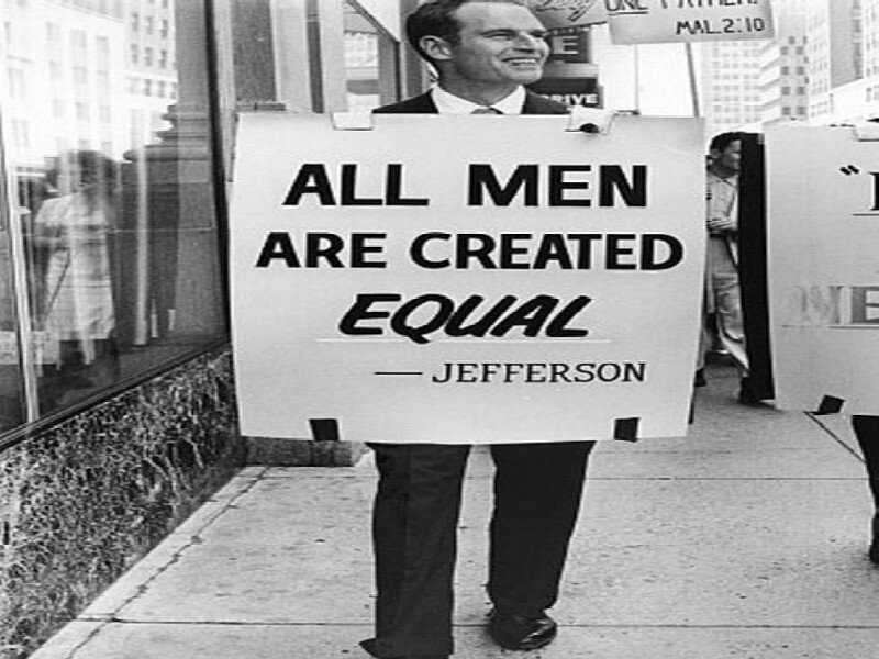 Man Holding Protest Sign — Black