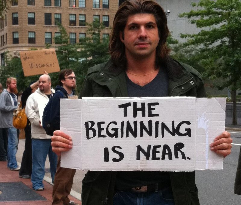 Man Holding Protest Sign — White
